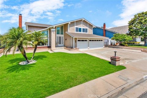 Panoramic views of rolling hills, snowcapped mountains, and city lights! Nestled in Anaheim Hills' desirable Stonegate community, this spacious home exudes curb appeal and lots of potential. The interior features an elegant living room with a cozy fi...