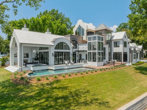 Welcome to Whispering Oaks, a modern estate designed by Elite Design Group and built by Grandfather Homes, that over looks 300' of waterfront on Lake Norman with a sandy beach just inside the no wake zone on open water. With more than 9,700 sf under ...