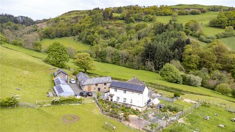 Situated on a hillside with breathtaking 360-degree views, Tanyfoel is a detached, three bedroom farmhouse set on approximately 42.8 acres of diverse natural landscape. The property includes an established holiday letting business that recently gener...