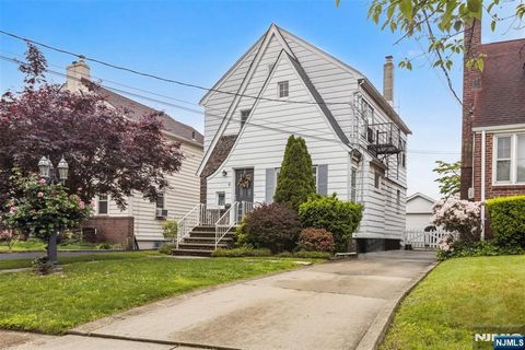 Welcome to 21 Berkeley Ave in Belleville, a charming, two-story home offering a blend of classic Tudor architecture and modern amenities. Upon entering, you are greeted by elegant Tudor archways and original stained glass windows that lead you throug...