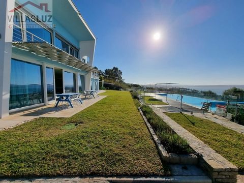 6 bedroom modernist villa with 7 bathrooms, office, mini golf course and a large swimming pool with a breathtaking view over the Óbidos Lagoon in Foz do Arelho. View of the Óbidos Lagoon and the sea until the interior of 'Poça dos Ninhos'. There are ...