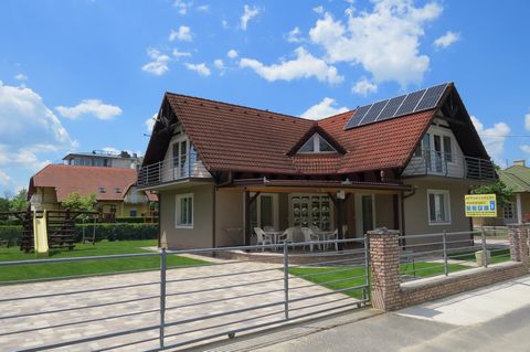 The Beach House is located in thevillageofBalatonlelle, on a dead-end street nearLake Balaton. In this quiet environment you can relax, enjoy the sunshine and take a refreshing dip in the Balaton, which is just 30m away. In the garden there is a slid...