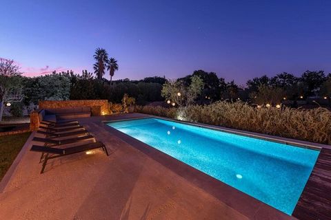 Relax in this amazing holiday home. The swimming pool (12m x 6m) has a passive heating system and is surrounded by spacious relaxation areas. The beautifully landscaped garden with cypress trees offers plenty of privacy. Impressive wooden double door...