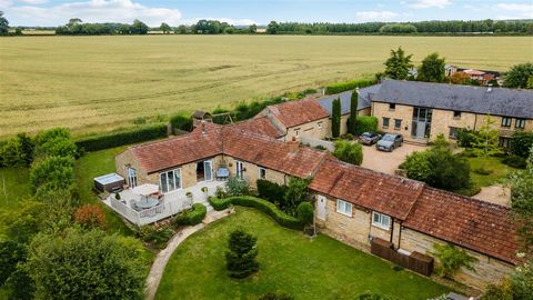 A delightful 18th century stone built, four bedroom barn conversion set in gardens of around 1/3 of an acre. Approached via a private drive through a communal wooded area, this stunning property was converted in 1995, and is located on the edge of th...
