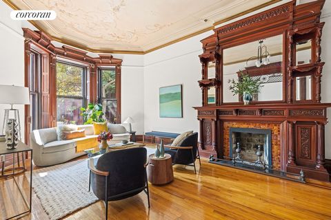 Perfectly situated on one of Park Slope's most sought-after tree-lined blocks, this 21 ft-wide, four-story brownstone epitomizes architectural elegance. Graced by a stately front stoop and intricate period details, this timeless residence features a ...