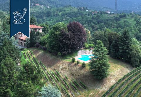 This stunning property for sale near Milan is endowed with all comforts and is embedded in a vast green area. This estate is made up of a main villa, a 17th-century rural home and a building for the production of wine. All these buildings, whose arch...