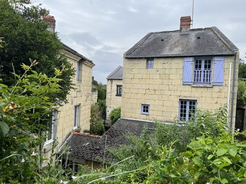 Tufa house in village on the banks of the Loire offering on the ground floor: entrance, kitchen open to beautiful vaulted dining room with fireplace and bread oven, an office, living room / living room with insert, a bathroom Upstairs, landing servin...