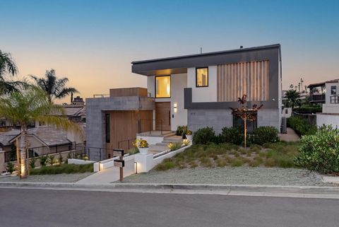 Recently built in 2022, escape to the coast in this contemporary seaside oasis designed by acclaimed architect Teale Architecture. Situated in the exclusive Newport Heights neighborhood, this custom home blends sleek modern design with laidback beach...
