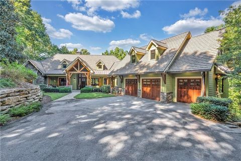 This custom lakefront home, with superior craftsmanship from Jeff Holder Builders, is located within the Founders section of the spectacular Reserve at Lake Keowee. Ideally situated in a private cul-de-sac on .85 acres, it offers both seclusion and c...