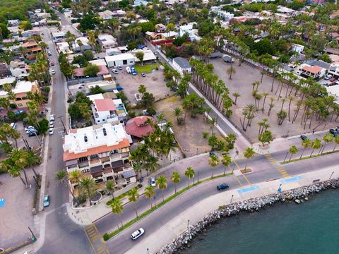 Prime lot with malecon front in Loreto, perfect for hotel or commercial development. This is an exceptional corner lot in an enviable location with untapped possibilities. This prime property boasts a flat terrain and has immense potential for your v...