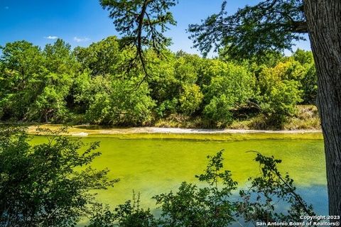 Nestled within the Hill Country, Zanzenberg River Lodge graces 29.52 acres, presenting an expansive 1700' of serene Guadalupe River frontage. The cornerstone of the estate is a majestic 4,450 sf stone home topped with a durable standing seam metal ro...