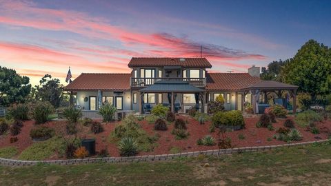 Welcome to your dream retreat! Nestled on a sprawling 3.5-acre fully-fenced and fully-irrigated property, this exquisite custom home offers unparalleled privacy and luxury in a serene rural setting. Perfect for those seeking tranquility and space, th...