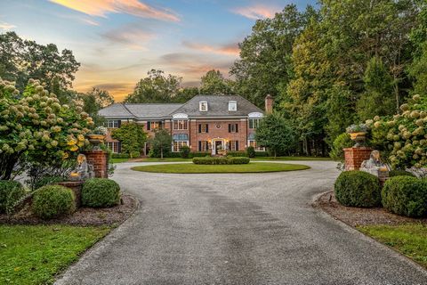 Majestic, Magazine Featured Home in Highly Desired Neighborhood. Located on a serene country lane in a sought-after pastoral neighborhood, known for its historic estates, sits a magnificent brick manor house with exceptional beauty and design. This s...