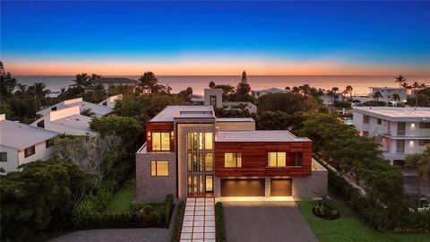 Discover unparalleled modern living at this custom contemporary residence nestled on a quiet street in the heart of Longboat Key. The exterior of this striking residence is a harmonious fusion of richly stained wood, imported stone, and oversized gla...