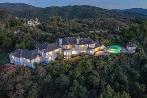 Extraordinary, One of a Kind, & Inspirational*This contemporary 7,480 SQFT view estate is located on 1.5 acres & includes a 230 SQFT guest house, an attached ADU, & 6 car garages*7 luxurious view suites, 6 full bathrooms & 2 half designer bathroomsl*...