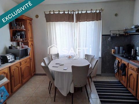 Maison mitoyenne sur 3 niveaux avec garage et extérieur
