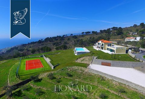 This villa for sale near Imperia is in a very beautiful position with an exceptional view over Liguria's sea. This recently-built property is modern with an internal surface of 800 m2 where every room is furnished with bespoke, high-quality piec...