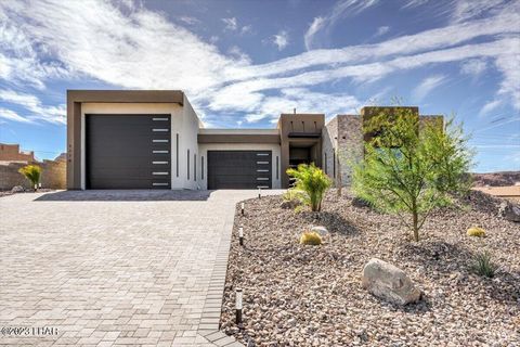 Smart home with Astonishing Sunrise, Sunset, Mountain, Lake, and Cityscape views. Paver clad driveway bordered by LED color changeable path lights, upgraded & up-lit desert landscape. Architectural metal awnings, 5400 sq. ft. under roof home. Custom ...