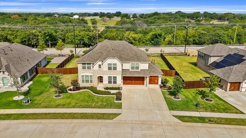 Experience luxury living in this pristine home, with two primary suites, perfect for multi-generational living. Set on a spacious half-acre in a desirable neighborhood, you're just minutes from Lake Lewisville, PGA Frisco, Little Elm, Aubrey, and Den...