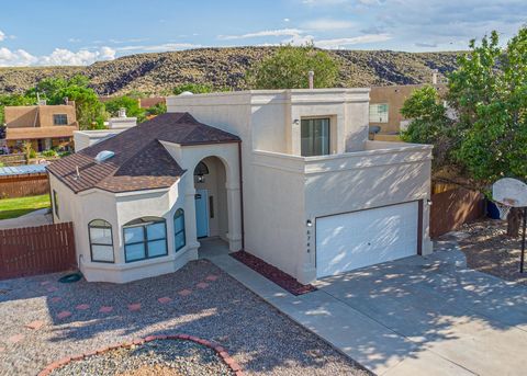 Welcome to your dream home! This stunning residence nestled in Albuqerques scenic Petroglyph Monument features soaring cathedral ceilings that create an airy, inviting atmosphere throughout. The modern kitchen boasts new stainless steel appliances an...