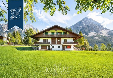 This luxurious chalet for sale is in a high position with a view of the Dolomites, just a few kilometres from the renowned ski town of Cortina D'ampezzo. Finely renovated and custom furnished in a typical Alpine style, this characteristic mounta...