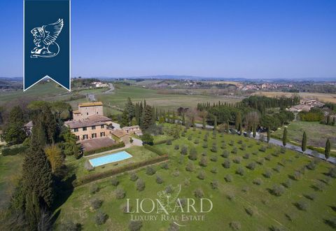 In Siena, a few steps from its splendid urban center, this rustic Tuscan-style farmhouse surrounded by the characteristic hilly landscape of the region is for sale. This structure consists of several buildings for a total total area of approximately ...