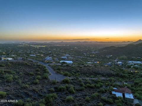 The Carriage Drive Lot is an elevated view home site located on the west face of Black Mountain in Cave Creek, Arizona. It offers a picturesque setting with the following features: 1. Scenic Views: The lot is positioned on the west face of Black Moun...