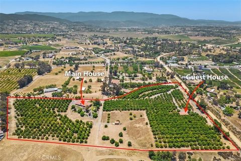Incredible Temecula Wine Country property on 12+ acres with 2 residences! This lovely timeless single story with open floorplan has been impeccably maintained. Main house with fabulous views and natural light throughout. Living room w/fireplace, form...