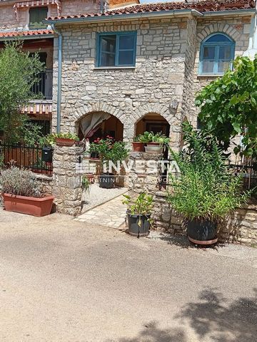 In the vicinity of Poreč, a terraced house on three floors, with a total area of 105 m2, is for sale. On the ground floor there is a small garden, a covered terrace, a living room with a kitchen and dining room, and a bathroom. A wooden staircase lea...