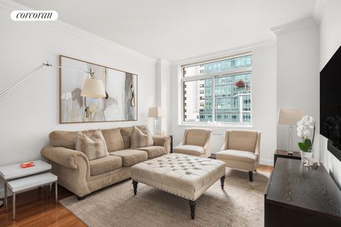 Floor-through 2 bedroom, 2.5 bath condo in the heart of Manhattan with city views and private outdoor space. Located in a full-time doorman boutique condominium, this bright residence features 10' ceilings and an efficient, practical layout with sepa...