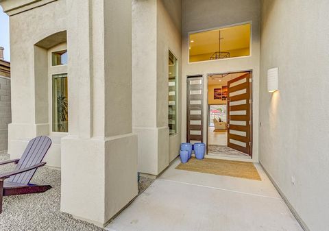 The Mountain House. A light, bright, and open remodeled contemporary, in Paloma Paseo. Stunning panoramic mountain views and soaring 20' ceilings. Chef's kitchen with modern clean lines and double island. 17' accordion glass door opens to covered pat...