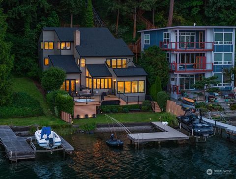 Welcome to your Lake Sammamish dream home. Positioned to feel like you're right on top of the lake, featuring a beautiful flat yard and a dock with a 7,000lb boat lift. Nearly every room captures inspiring views of Mt. Rainier, wildlife, and breathta...