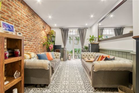 Offered with the always sought after Share of Freehold is this sizeable three bedroom flat comprising of over 1,000 sq ft of living space. Set on the lower ground floor of this early 20th century portered mansion block with lift, the apartment benefi...