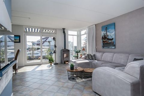 In the water sports village of Grou you will find this modern vacation home with its own jetty. As soon as the sun shines, it is wonderful to be able to sit outside in the south-facing, waterfront garden. Both in summer and in winter you can step fro...