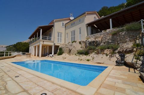 The island of Krk, Punat, Stara Baška, exclusive villa surface area 450 m2 for sale, with a swimming pool and panoramic sea view, on a plot of 1260 m2, 250 m from the beach! The villa consists of a basement with a garage for two cars of 38 m2 with re...