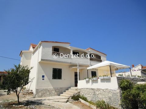 House is located on Island Drvenik Mali, near Trogir. Total surface 212 sq.m. on a land plot of 1860 sq.m. Ground floor: three bedroom apartment with two bathrooms. 1st Floor: Two bedroom apartment with one bathroom. Additional to house is summer kit...