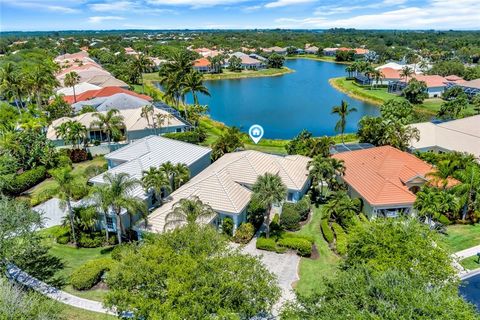 Price reduced by cost of NEW ROOF! Lakefront serenity! Incredible natural long lake view! 3br/3ba island home. Living area extends outside on covered lanai with screened & heated pool. Relax to the trickle of the waterfall. Wash off beach sand in enc...