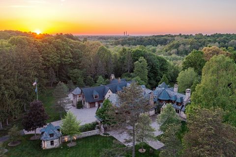 Situated on over 14 acres overlooking the Chagrin River Valley, this exceptional chalet provides the epitome of distinguished living in an unmatched natural setting. Originally designed by Tony Paskevich, this magnificent manse is an architectural tr...