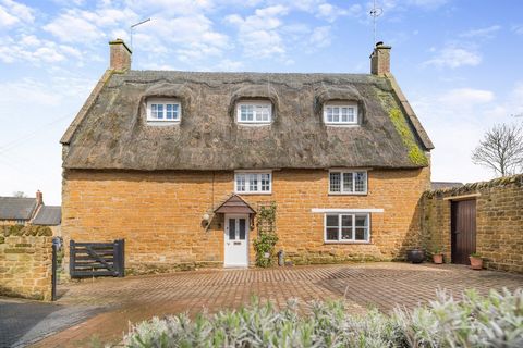 Hill Cottage is a charming Grade II Listed detached stone built and thatched property arranged over three floors and combining both traditional and contemporary features with deceptively spacious living space. There is also the added advantage and ve...