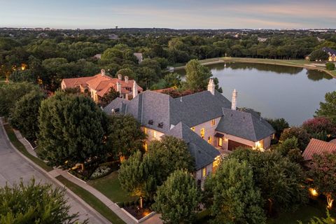 Absolutely stunning! From the moment you enter this fabulous estate the breathtaking water views will leave you awe-struck! Enjoy the lush grounds and stunning view of the infinity edge pool and fountain with cascading waterfalls that seamlessly blen...