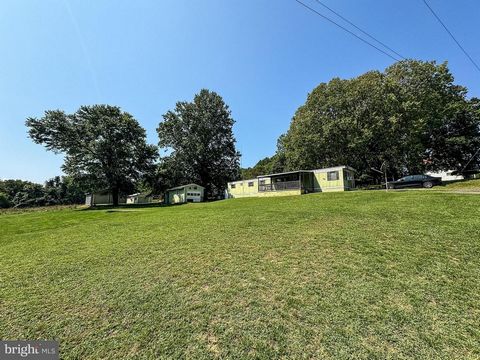 Set on a stunning lot, this property presents a unique opportunity for those looking for space and potential. The manufactured home is in livable condition but would benefit from some TLC, making it an ideal project for renovation enthusiasts. The tr...