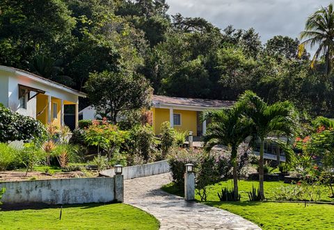 Your private hide-away in a lush, green paradise. A property for dropping out on a high level. Close to the beaches, but away from the noise. Two individual houses with full equipment, each approx. 100m2, fully air-conditioned, excellent construction...