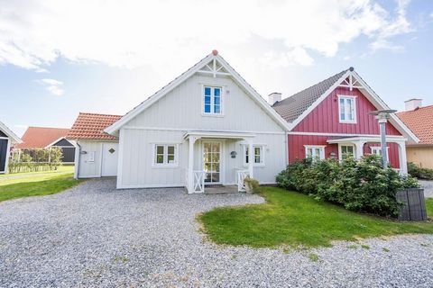 MAX 2 DOGS - Not far from Blåvand's lovely beach, shops and restaurants you will find this cozy holiday home. The house is part of a terraced house building in Scandinavian building style with a cozy atmosphere with small streams and footbridges. The...
