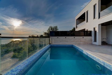 Villa with Pool and Panoramic Sea View in Crikvenica! Total area is 185 sq.m. Land plot is 200 sq.m. This stunning new semi-detached property, complete with a pool, is located approximately 550 meters from the sea. The villa's most striking feature i...