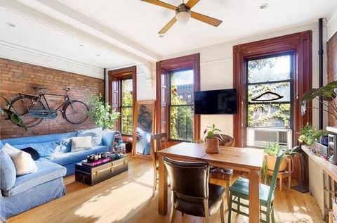 This stunning two-bedroom, one-bathroom apartment offers a perfect blend of historic charm and modern amenities. Featuring beautiful original details such as high ceilings, oversized windows, pocket shutters, exquisite woodwork, hardwood floors with ...