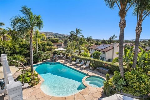 Quintessential resort-style living with stunning panoramic views in San Juan Capistrano! Step outside into an expansive backyard oasis complete with large pool and spa, outdoor kitchen, outdoor fireplace, pirate-style playhouse, water feature pond wi...