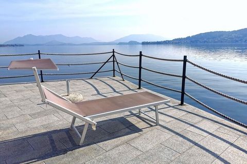 Comfortable and elegant residence near the center of Meina, directly on Lake Maggiore. You live in a holiday apartment on the ground floor with a shared garden and a partial lake view. The complex has a pool and a lawn from where you can enjoy a wond...