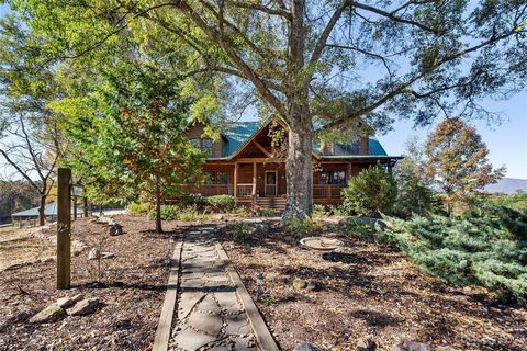 Welcome! This stunning log cabin home is a true equestrian paradise, offering an idyllic blend of rustic charm and modern amenities. Step inside, you'll be greeted by a massive great room boasting a wood-burning fireplace, creating the perfect cozy a...