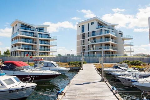 Modern and comfortable apartment with a view of the Baltic Sea and the marina. Enjoy the beautiful panoramic view of the Baltic Sea from morning to night. The modern and comfortably furnished apartment consists of an open kitchen-living area with din...