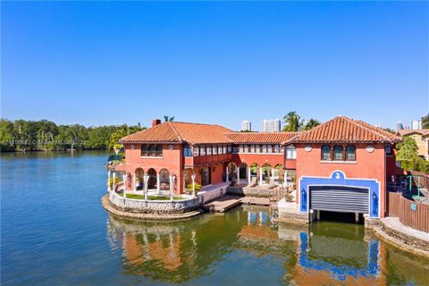 SE Florida TROPHY waterfront estate; Magnificent 1.6-acre parcel with approx. 350 ft of pristine water frontage facing Oleta State Park & the Intracoastal with it's own Boathouse! Three folios totaling 70,662 SF including a Private Island, TWO Kitche...